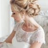 Curly Bridal Bun Hairstyles With Veil (Photo 13 of 25)
