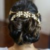 Undone Low Bun Bridal Hairstyles With Floral Headband (Photo 2 of 25)
